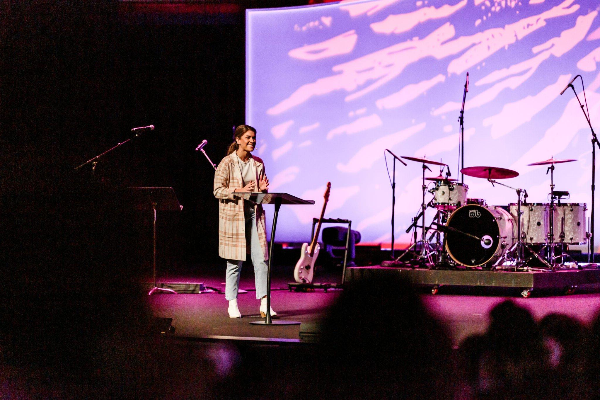 Speaker on stage at New Student Institute